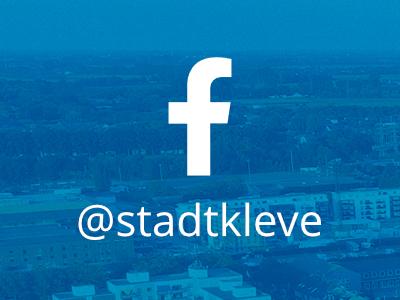 Das Facebook-Logo vor einer Drohnenaufnahme der Stadt Kleve